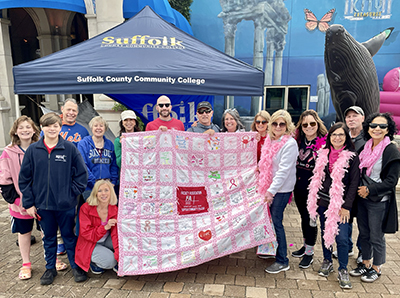 Teresa Noto (ninth from left), a member of the Faculty Association of Suffolk Community College and her colleagues walk and raise funds for Making Strides of Eastern Long Island.